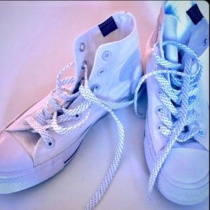 Chick Taylor with hightop sneakers.